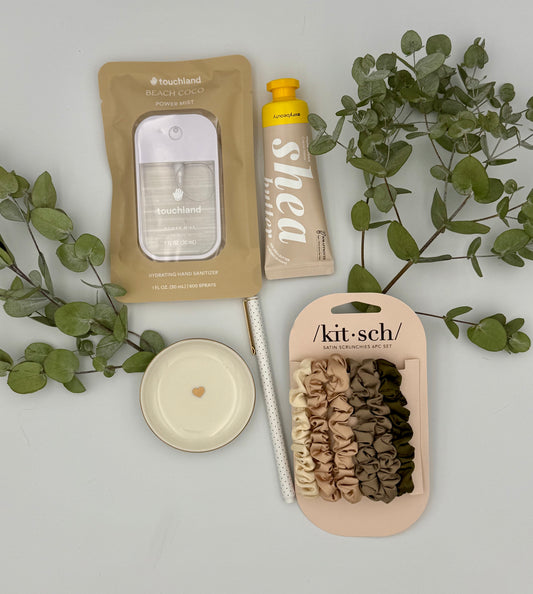 Kit-sch hair ties packaging with green leaves on a light gray background