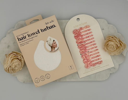Hair towel turban packaging with a floral decoration on a gray background
